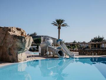 a water slide next to a pool