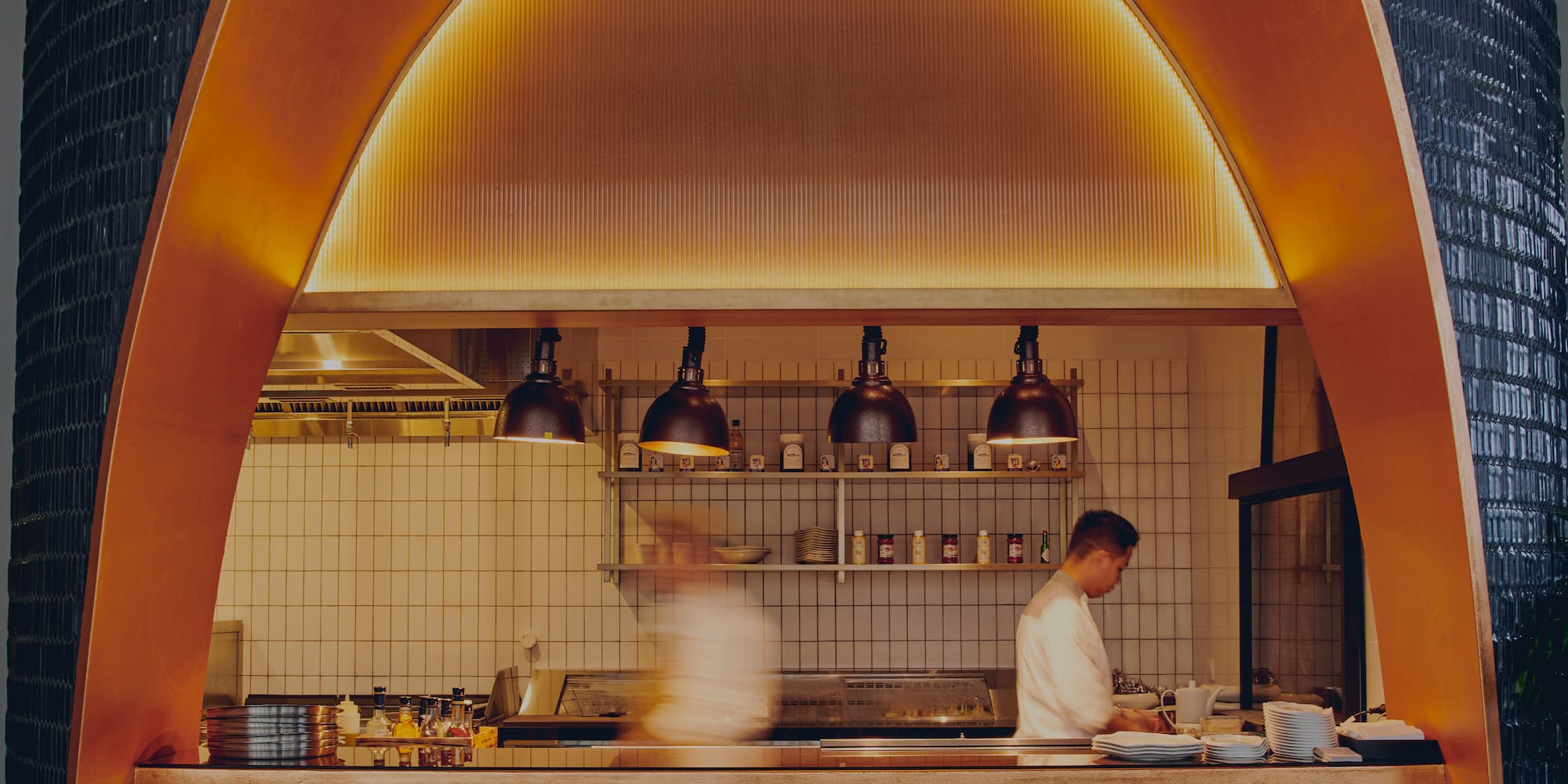 two people cooking in a kitchen