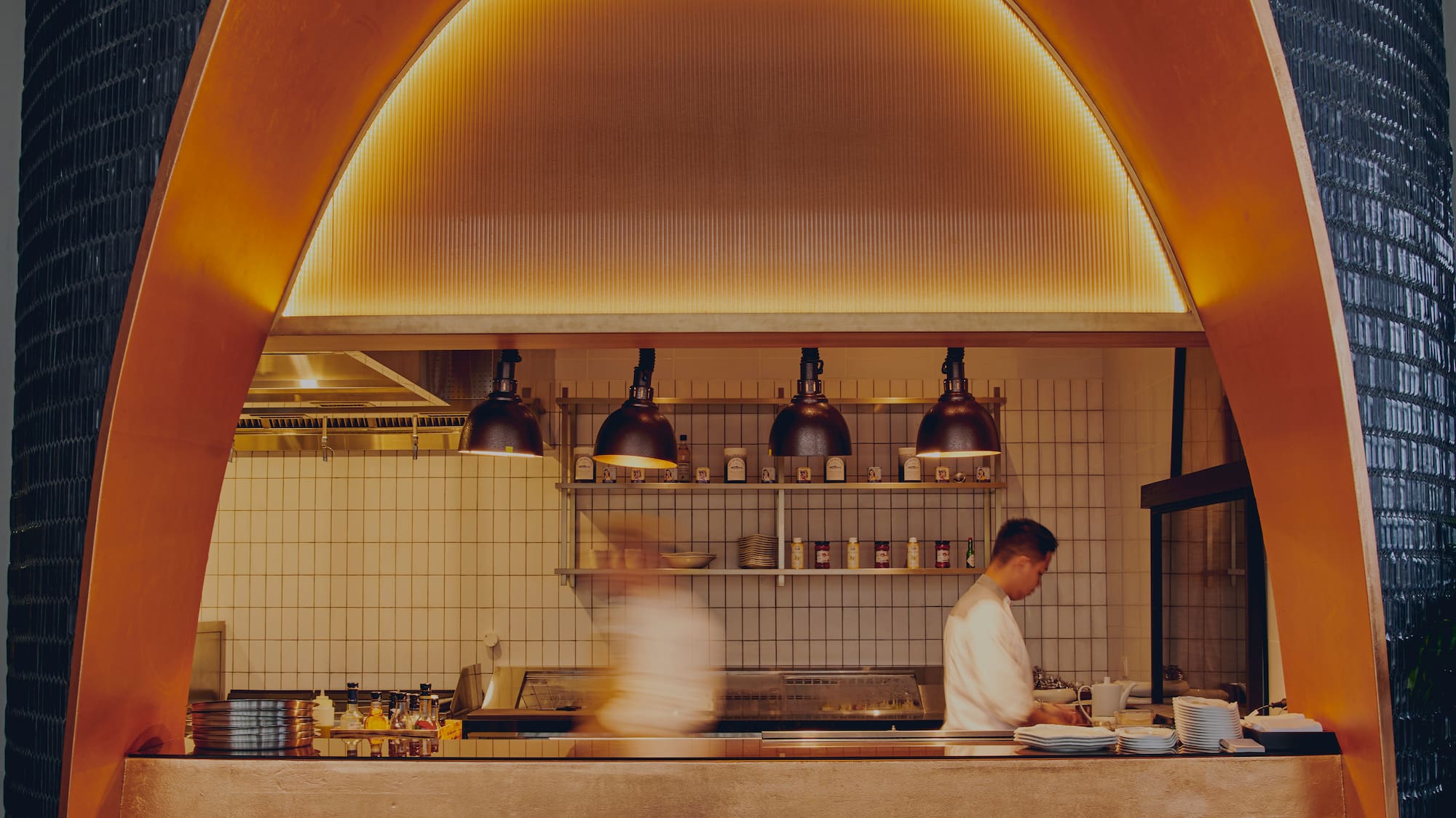 two people cooking in a kitchen