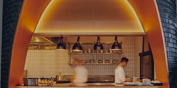 two people cooking in a kitchen