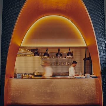 two people cooking in a kitchen