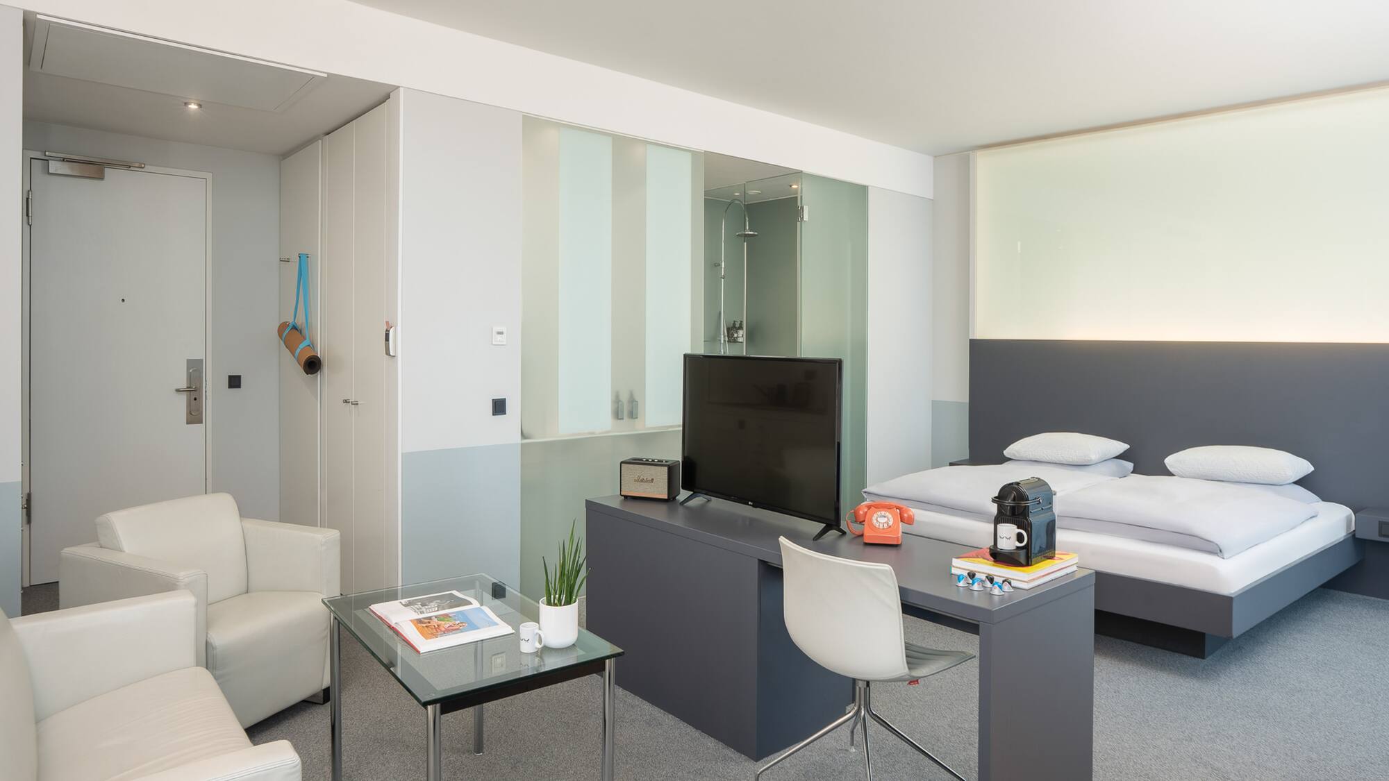 a room with a tv and a bed