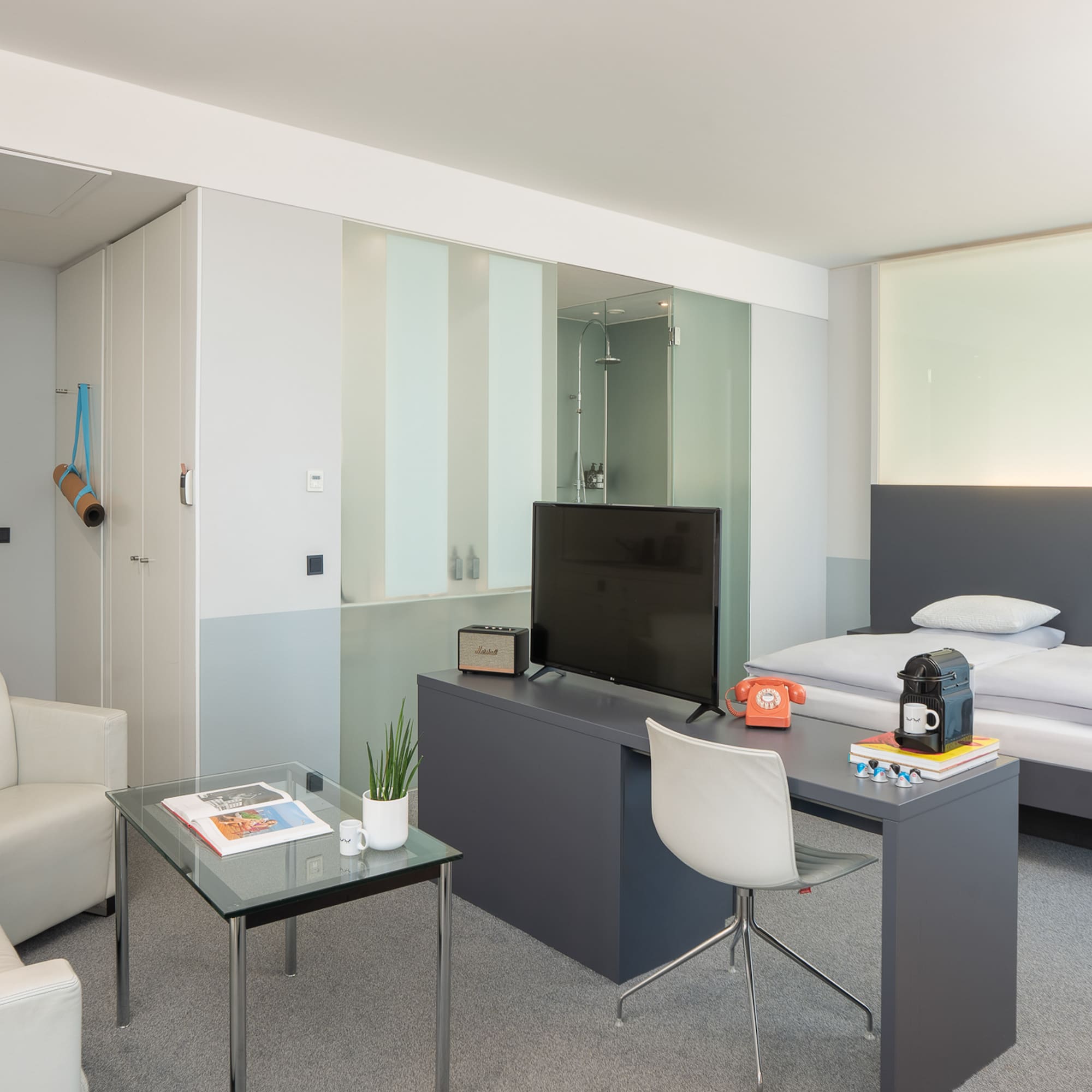 a room with a tv and a bed