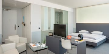 a room with a tv and a bed