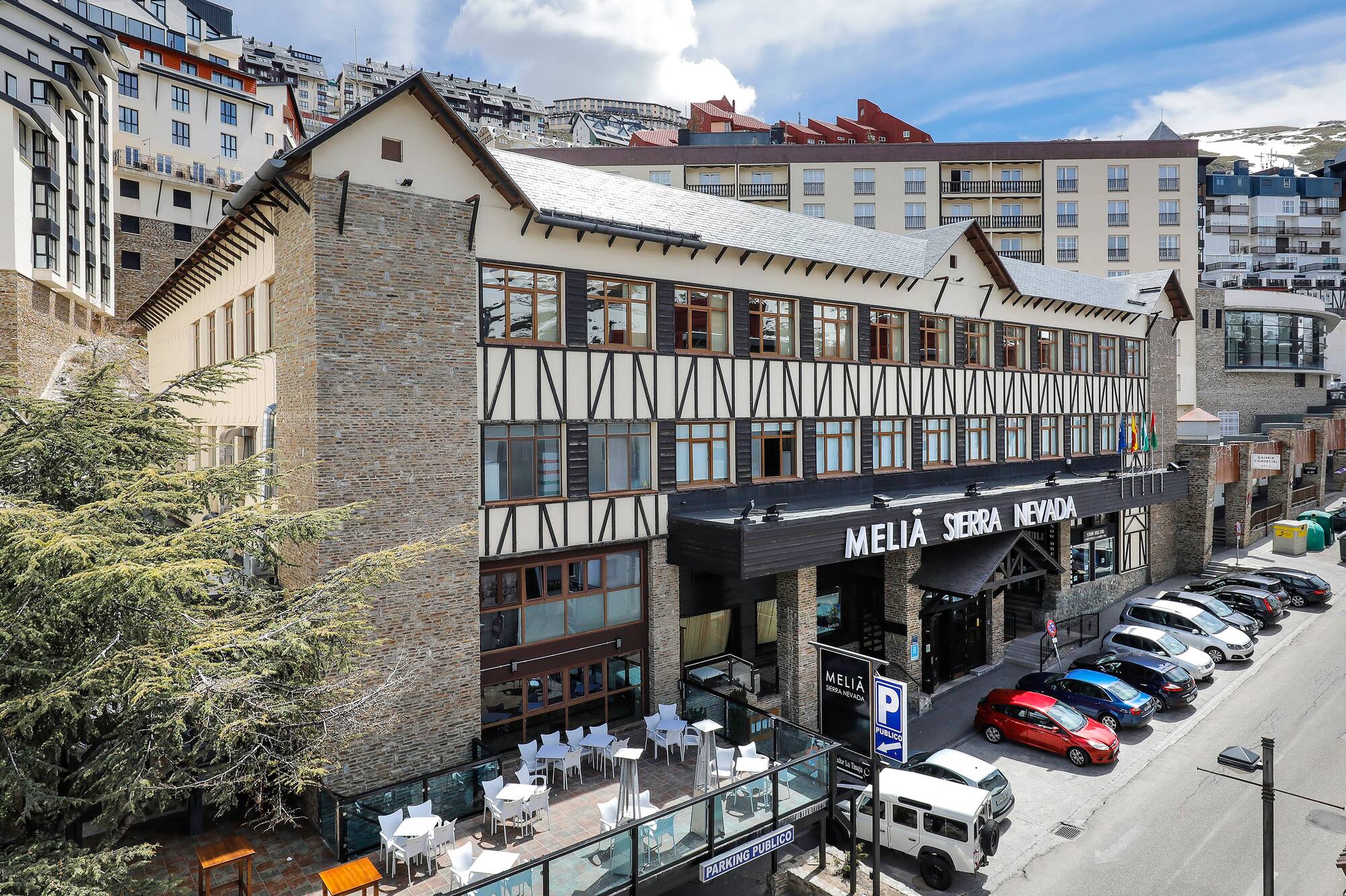 Melia Sierra Nevada hotel exterior, traditional mountain resort architecture.