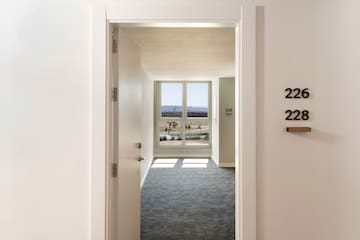 a hallway with a door and a window