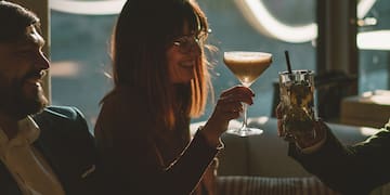 a group of people sitting at a table with drinks