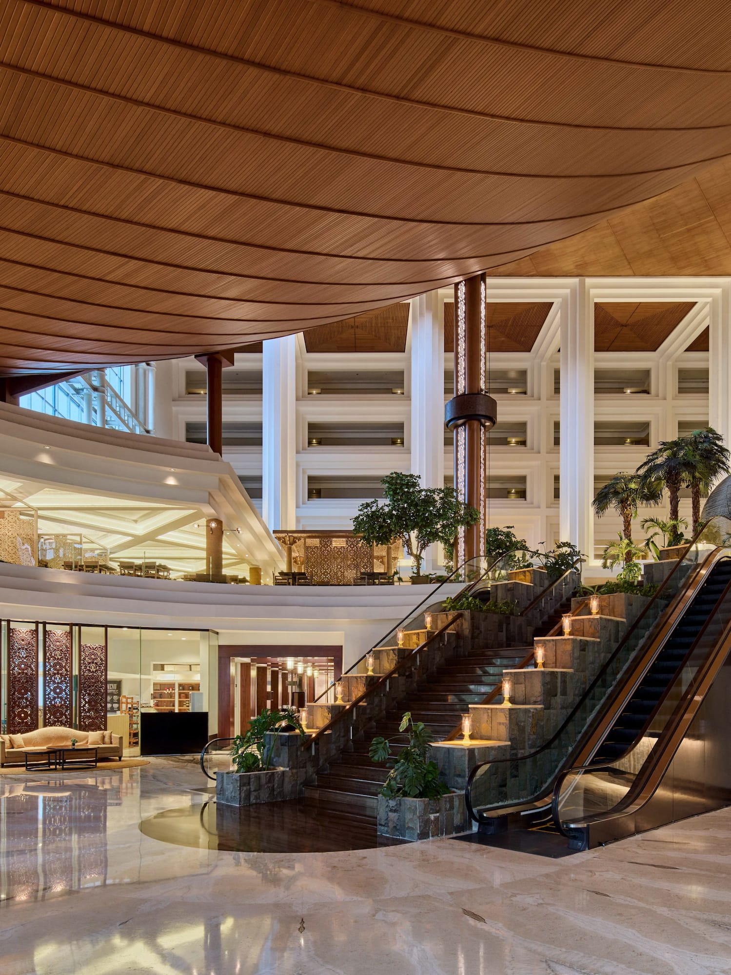 a large building with a staircase and escalator
