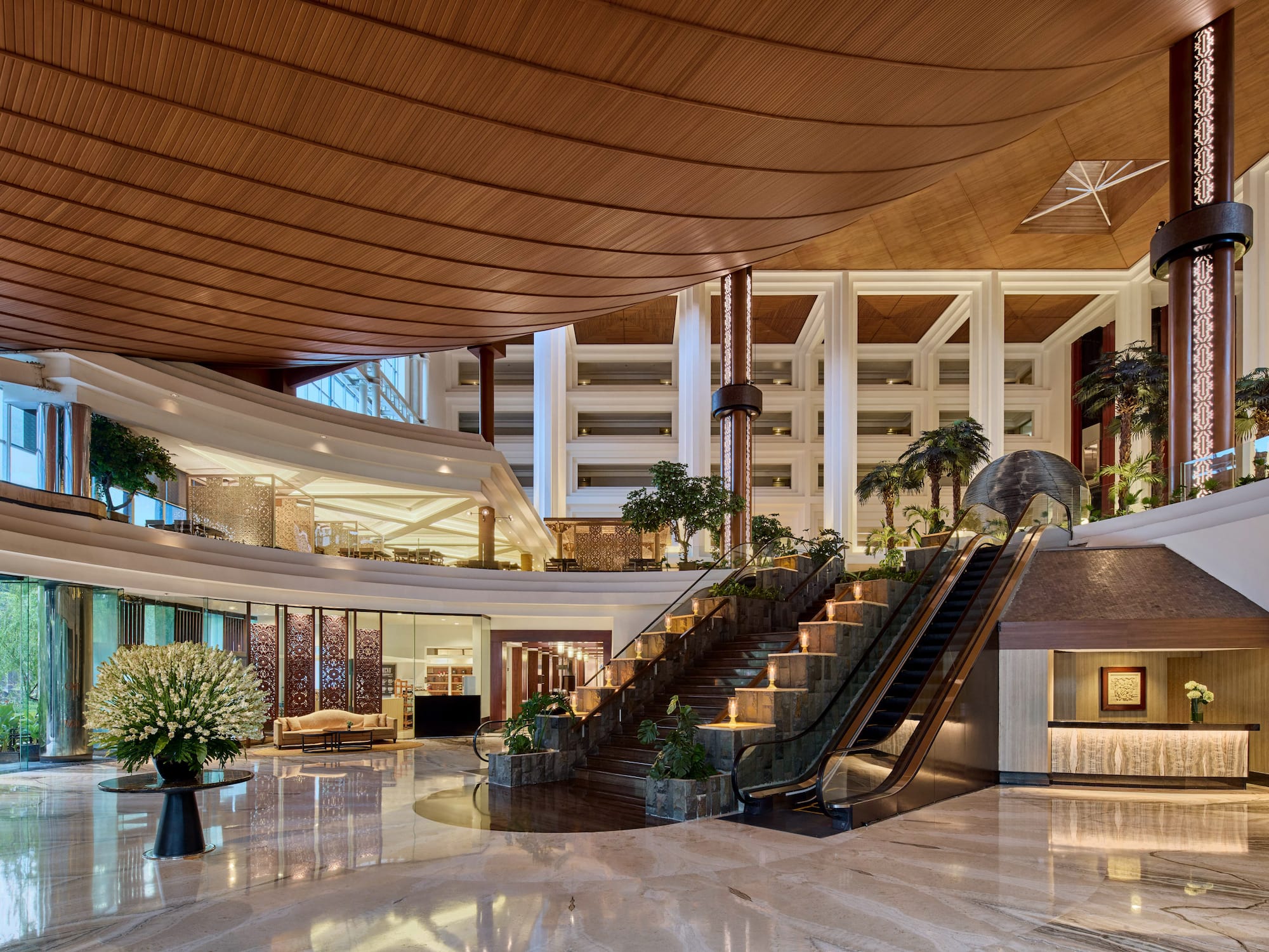 a large building with a staircase and escalator