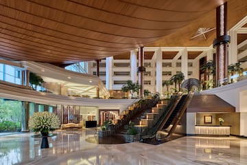 a large building with a staircase and escalator