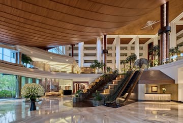 a large building with a staircase and escalator