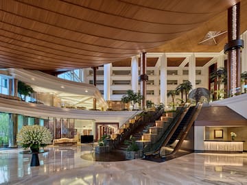 a large building with a staircase and escalator