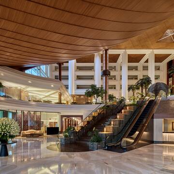 a large building with a staircase and escalator