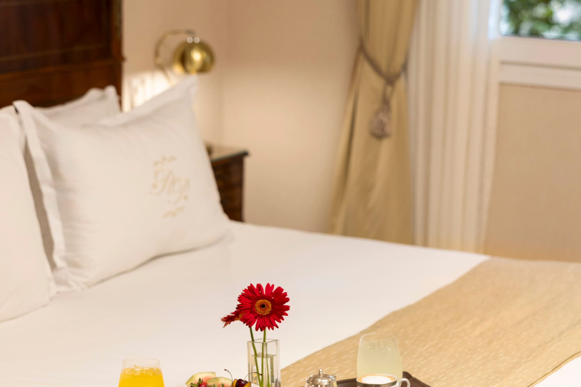 a tray of breakfast on a bed