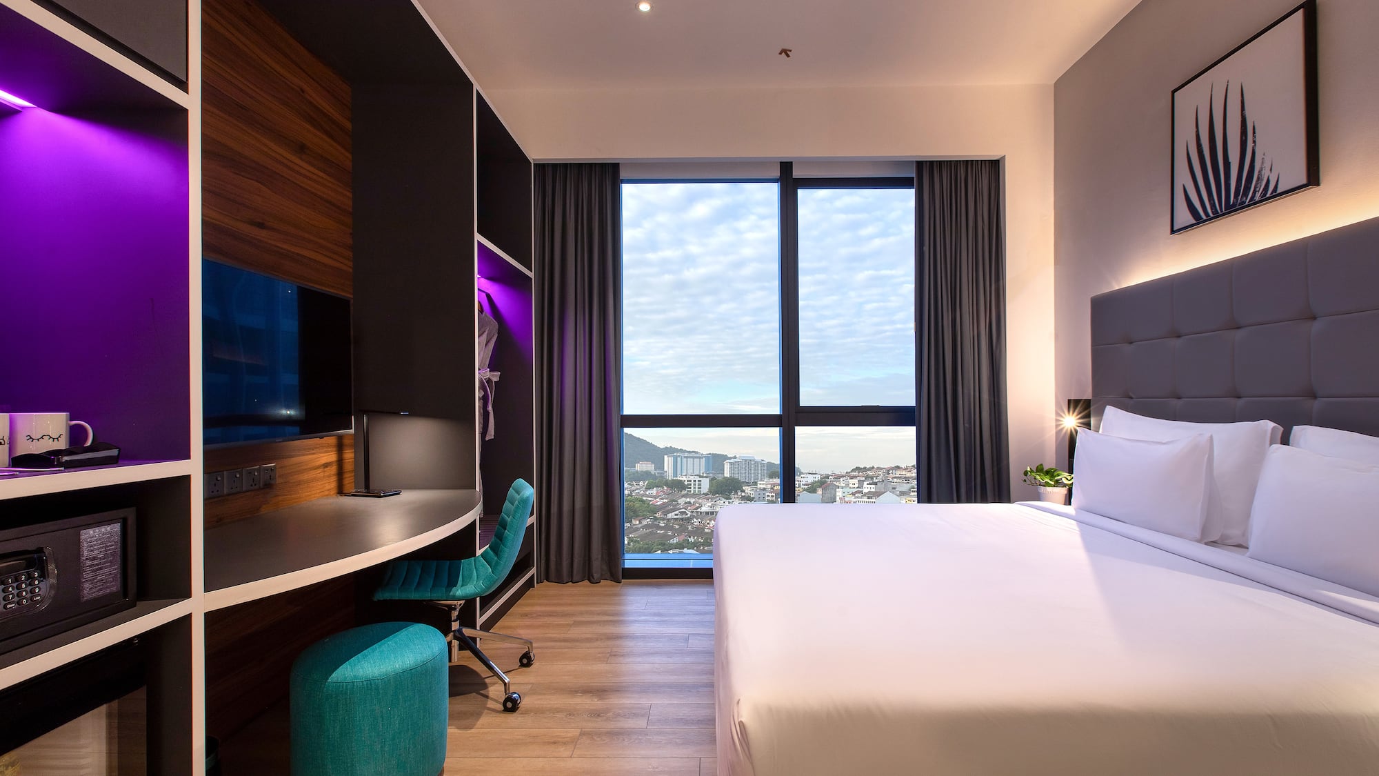 a room with a large window and a bed