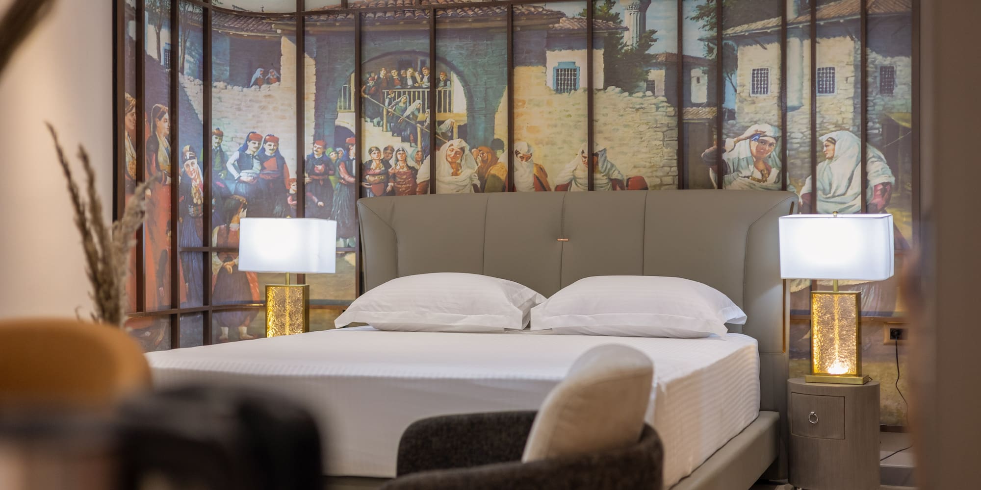 a bed with a wallpaper on the wall