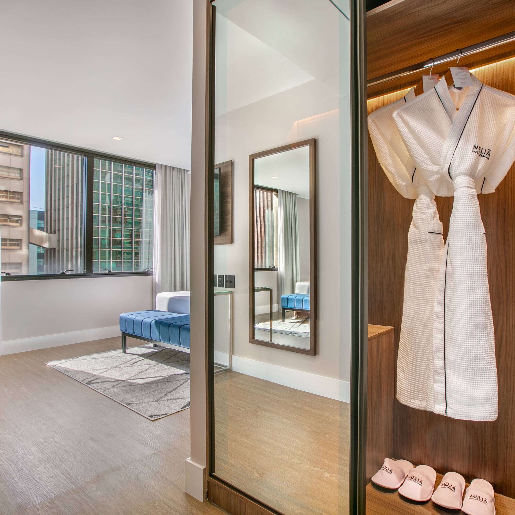a room with a white robe and shoes