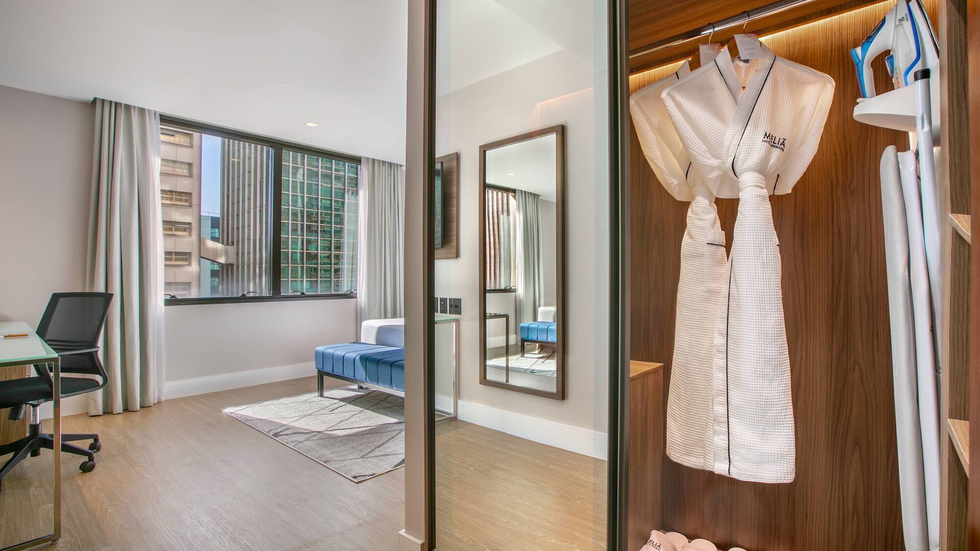 a room with a white robe and shoes