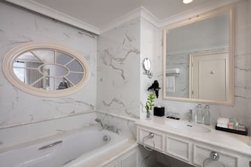 a bathroom with a tub and sink