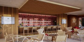 a room with a bar and chairs