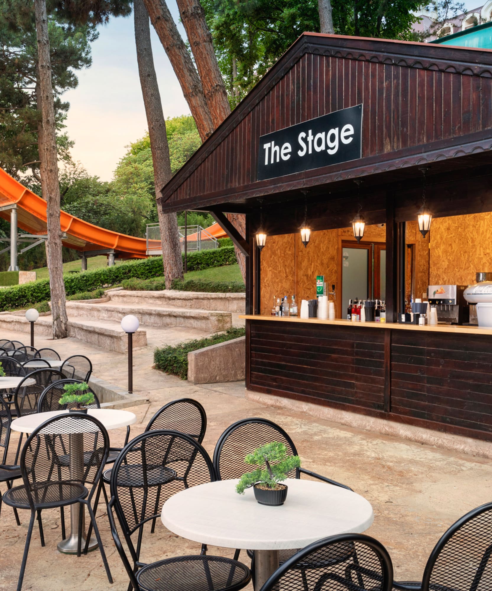 a small outdoor bar with tables and chairs
