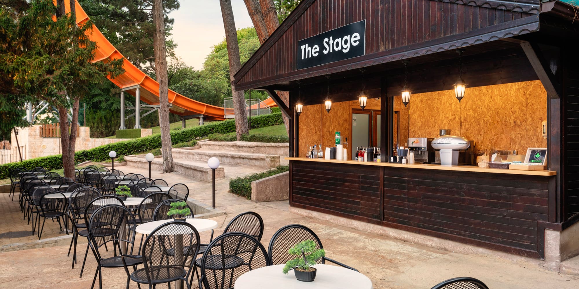 a small outdoor bar with tables and chairs