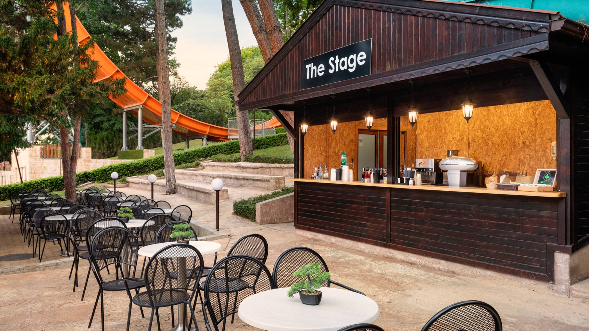 a small outdoor bar with tables and chairs