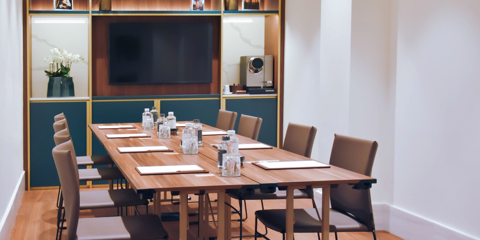 a conference room with a table and chairs
