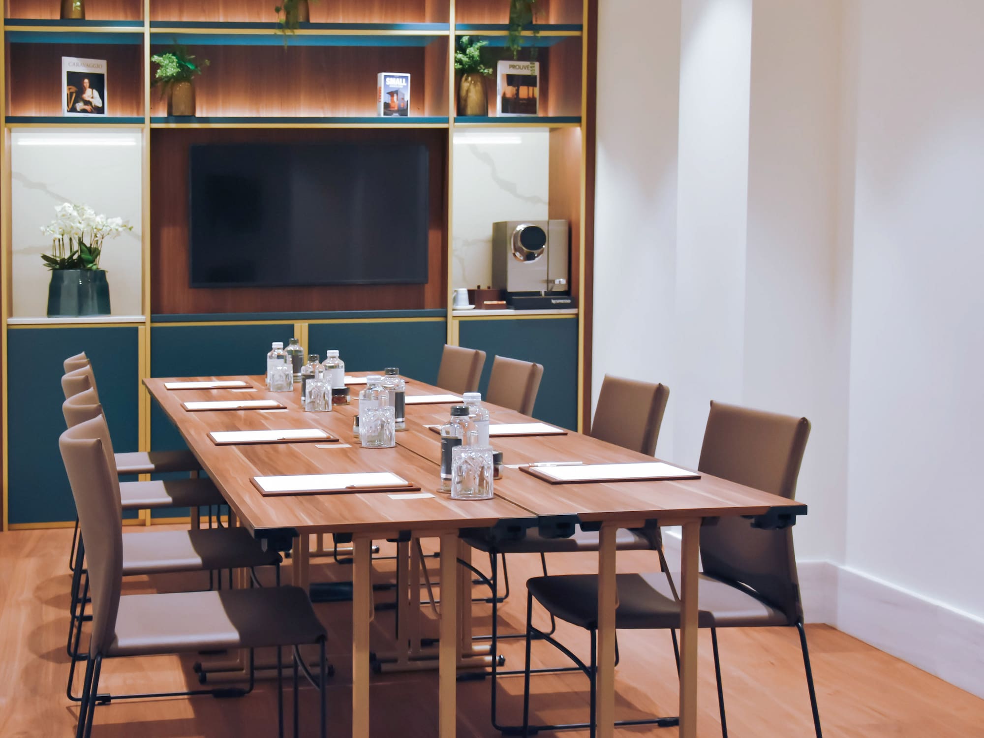 a conference room with a table and chairs