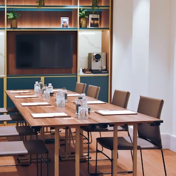 a conference room with a table and chairs