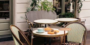 a table and chairs outside a building