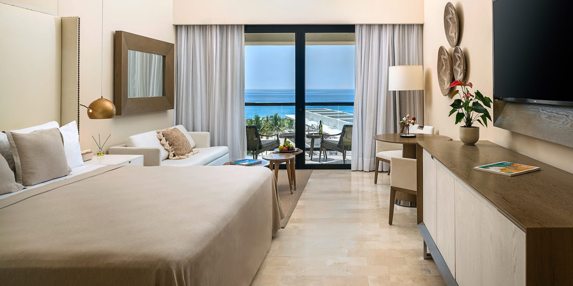 a room with a bed and a table and chairs