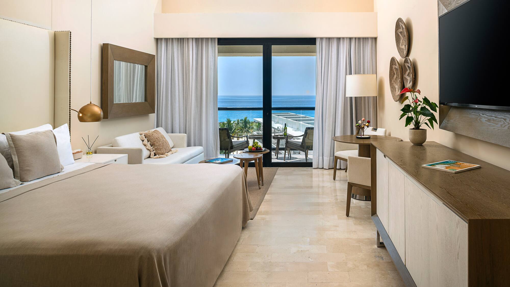 a room with a bed and a table and chairs