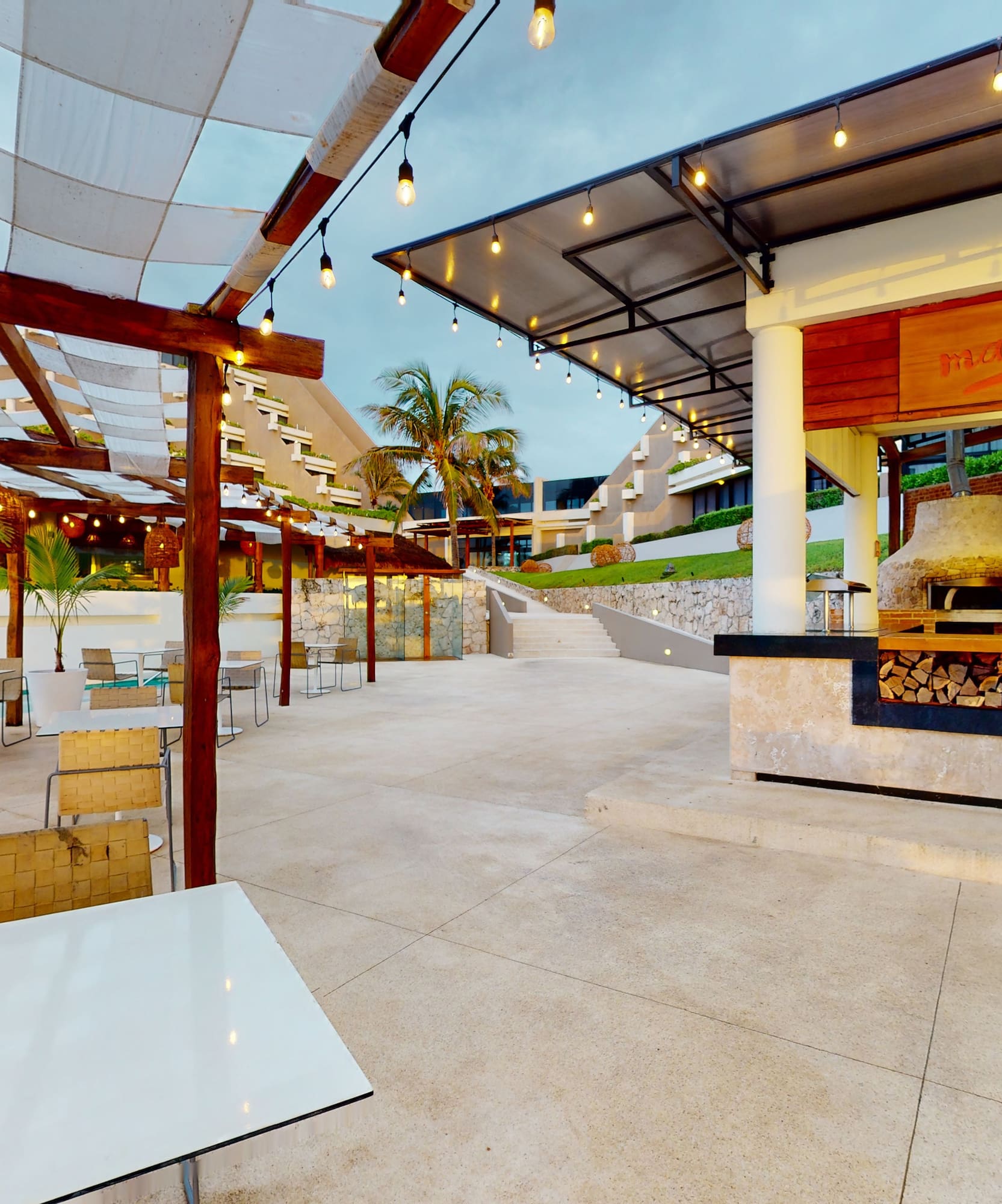 a patio with tables and chairs