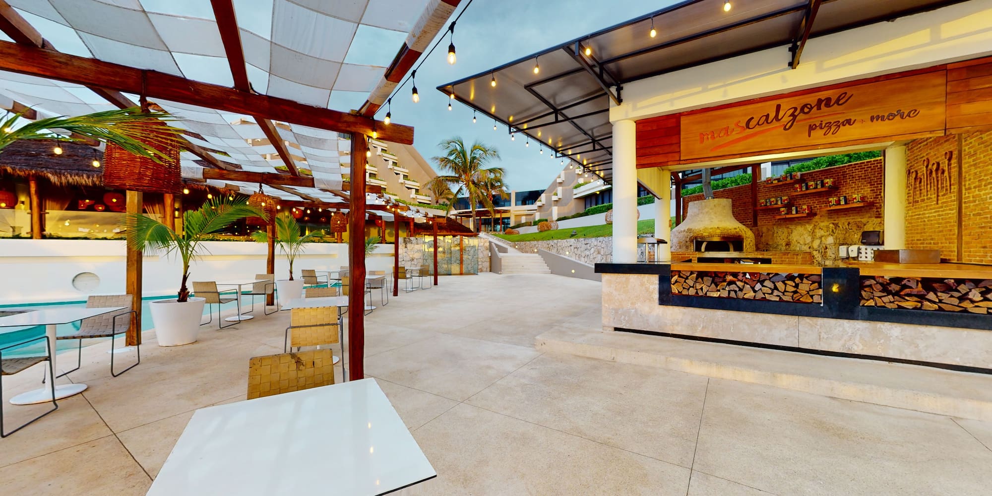 a patio with tables and chairs