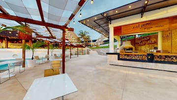 a patio with tables and chairs