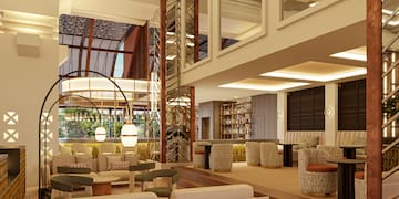 a room with a large staircase and a large sofa