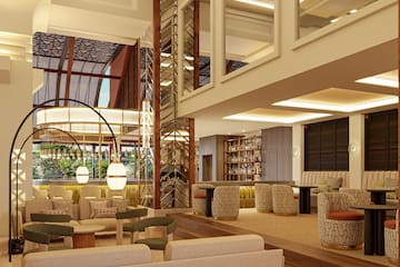 a room with a large staircase and a large sofa