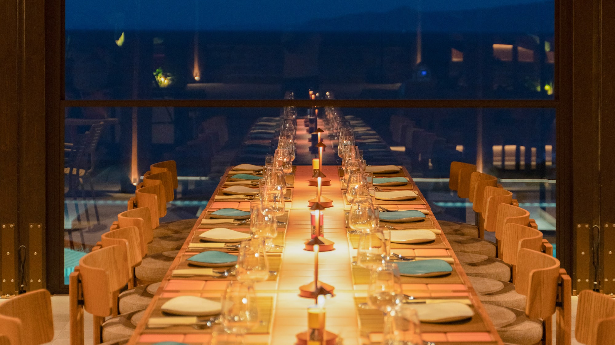 a long table with plates and glasses