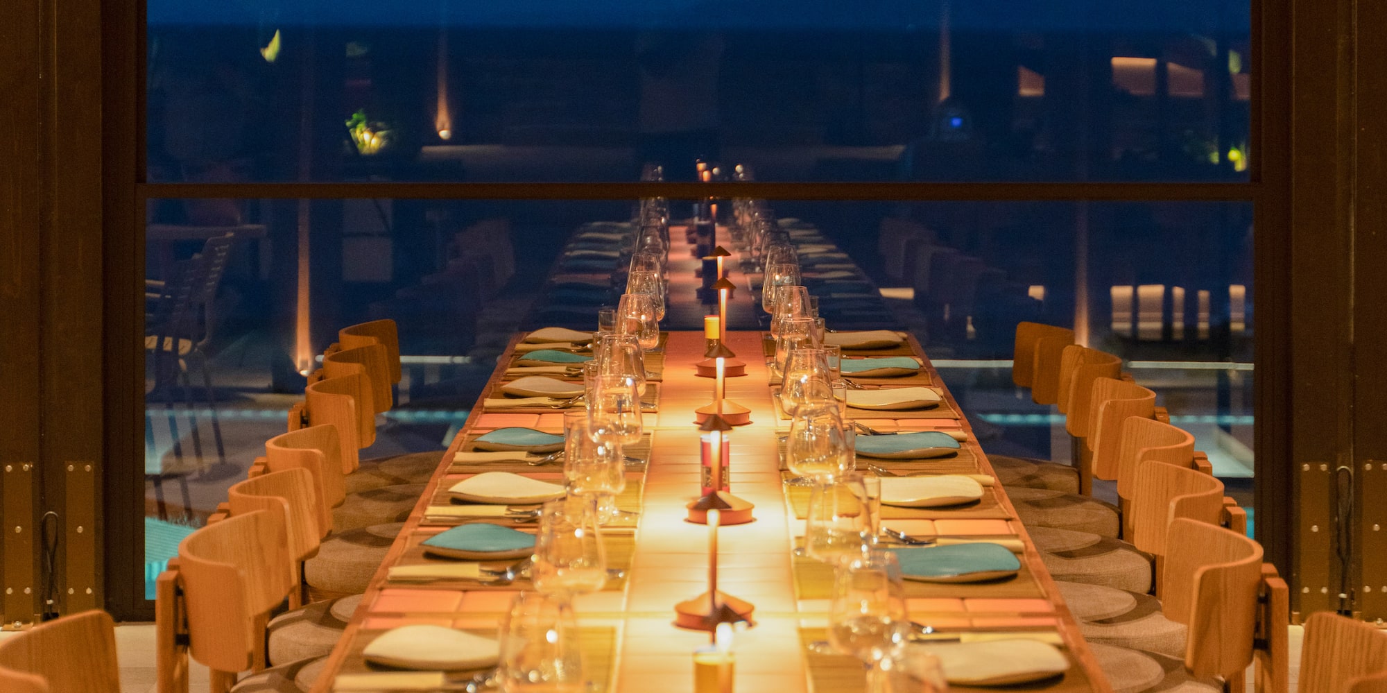 a long table with plates and glasses