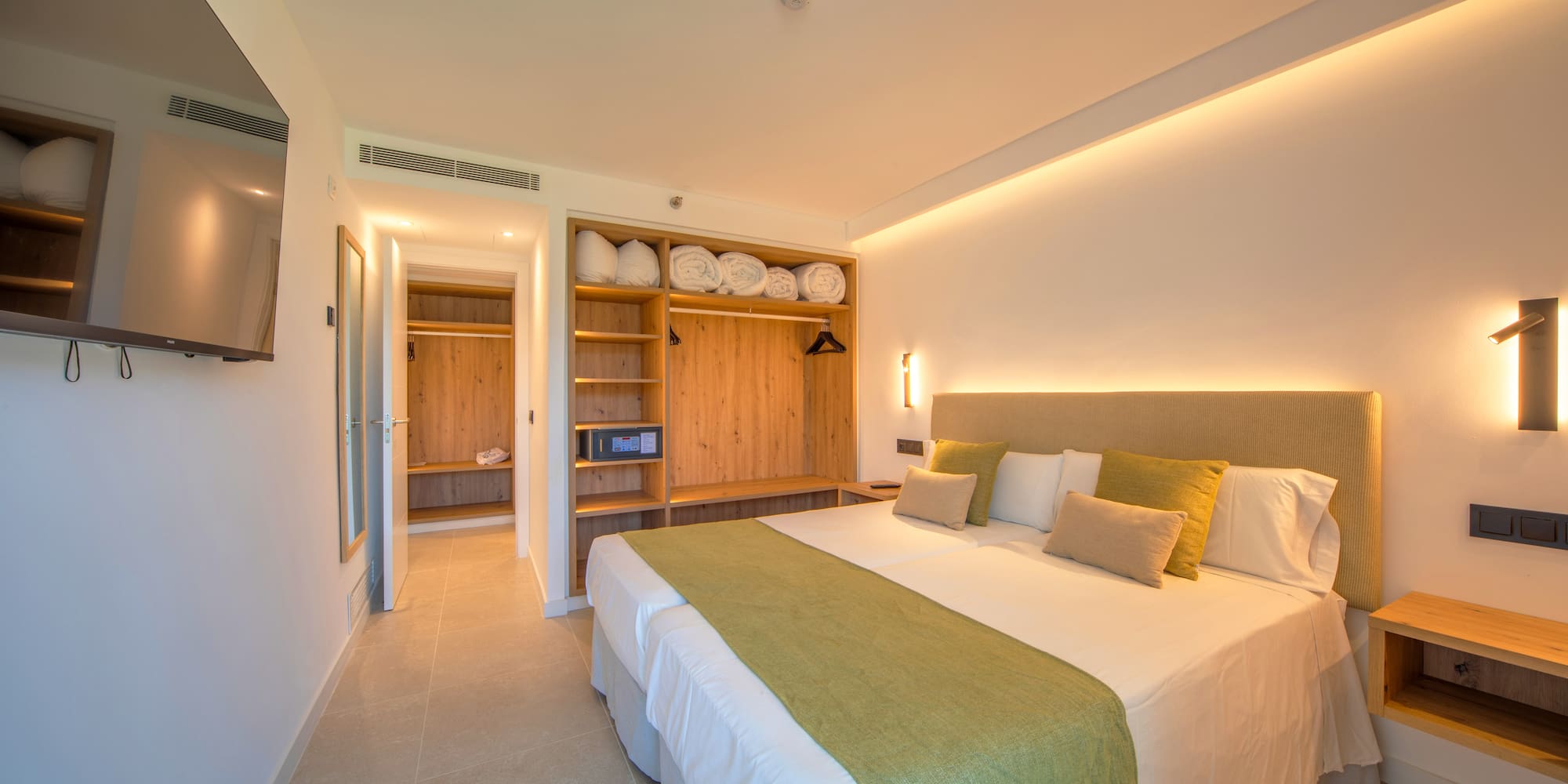 a room with a bed and shelves