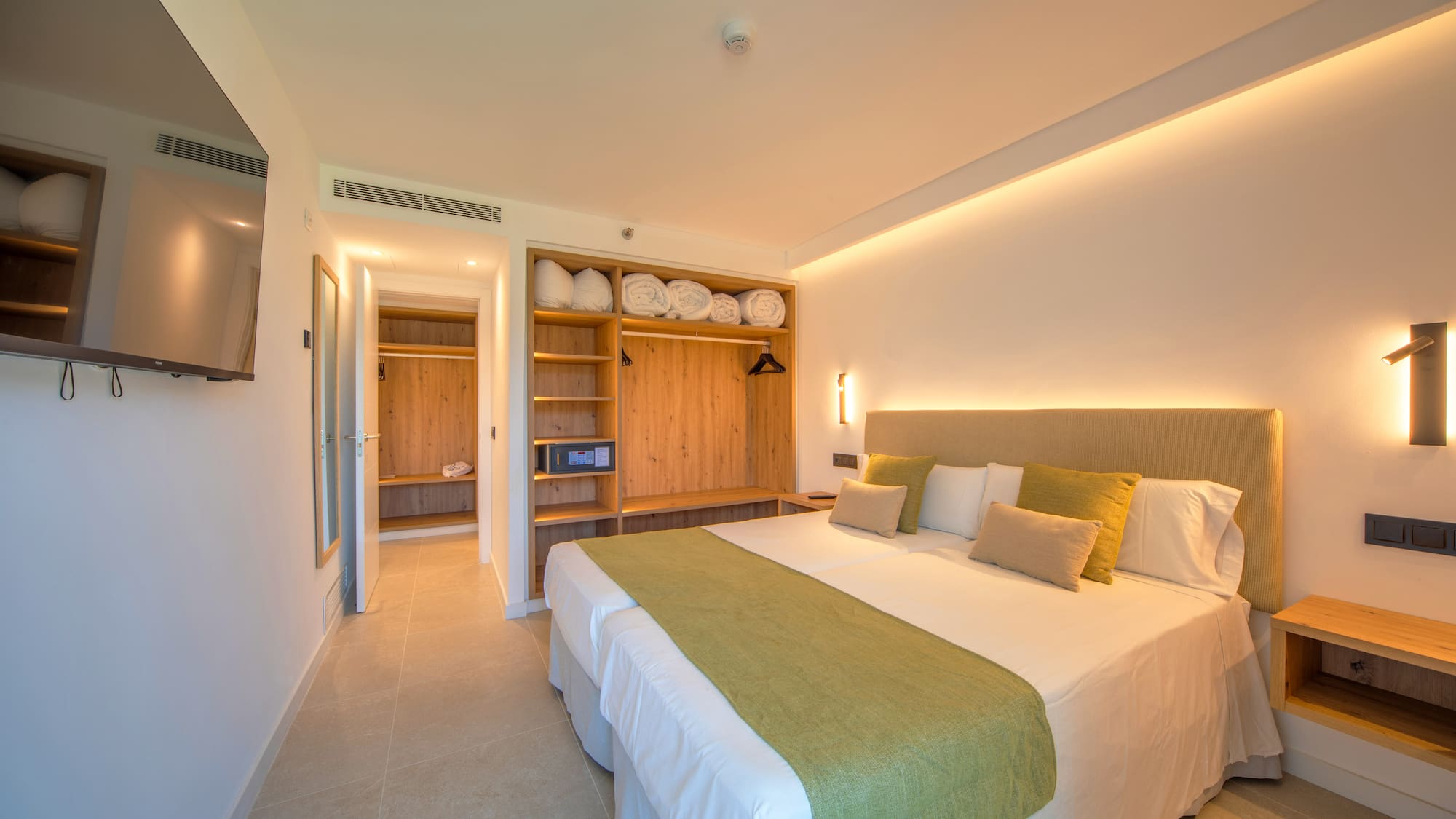 a room with a bed and shelves