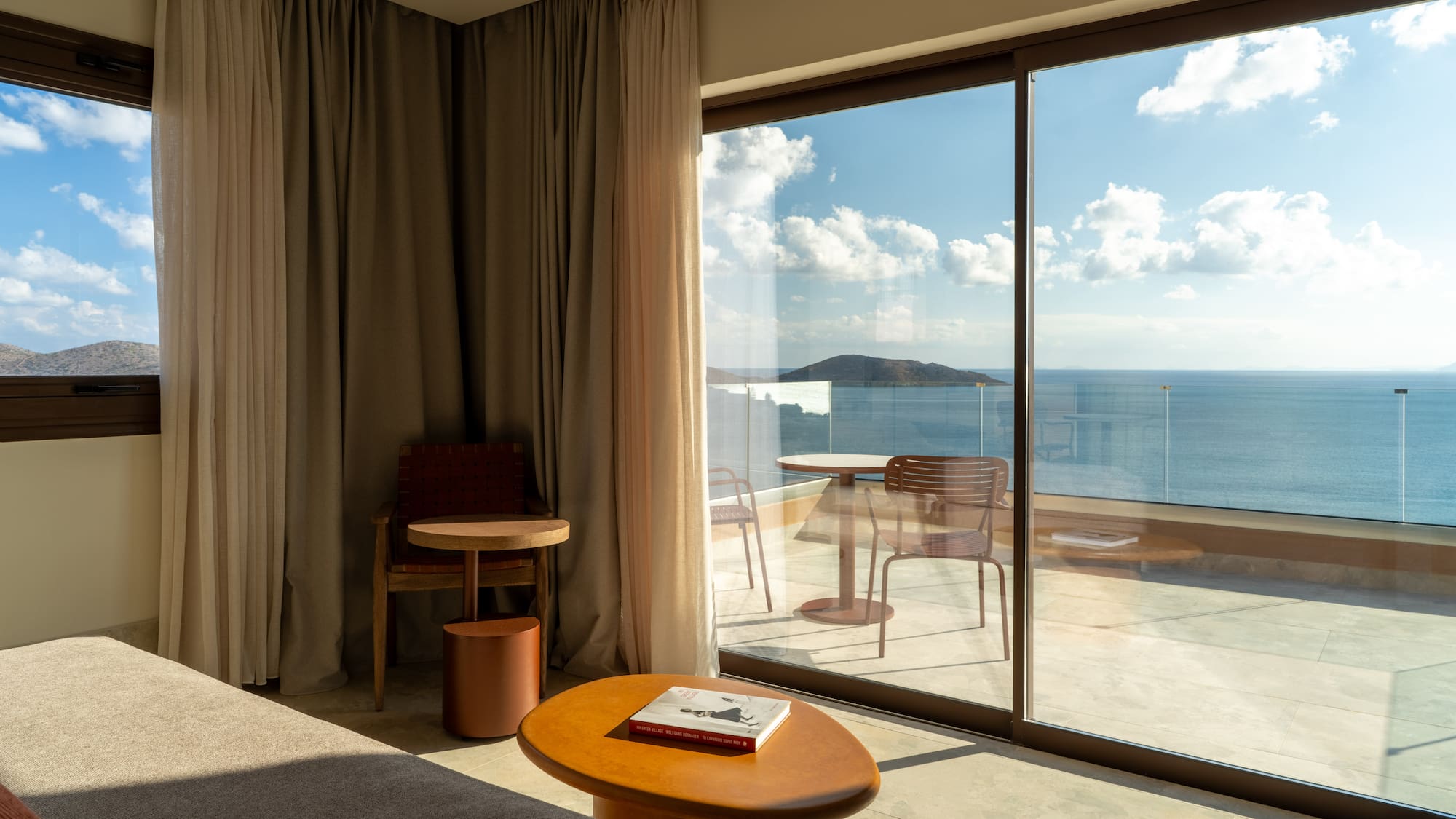 a room with a view of the ocean from the window