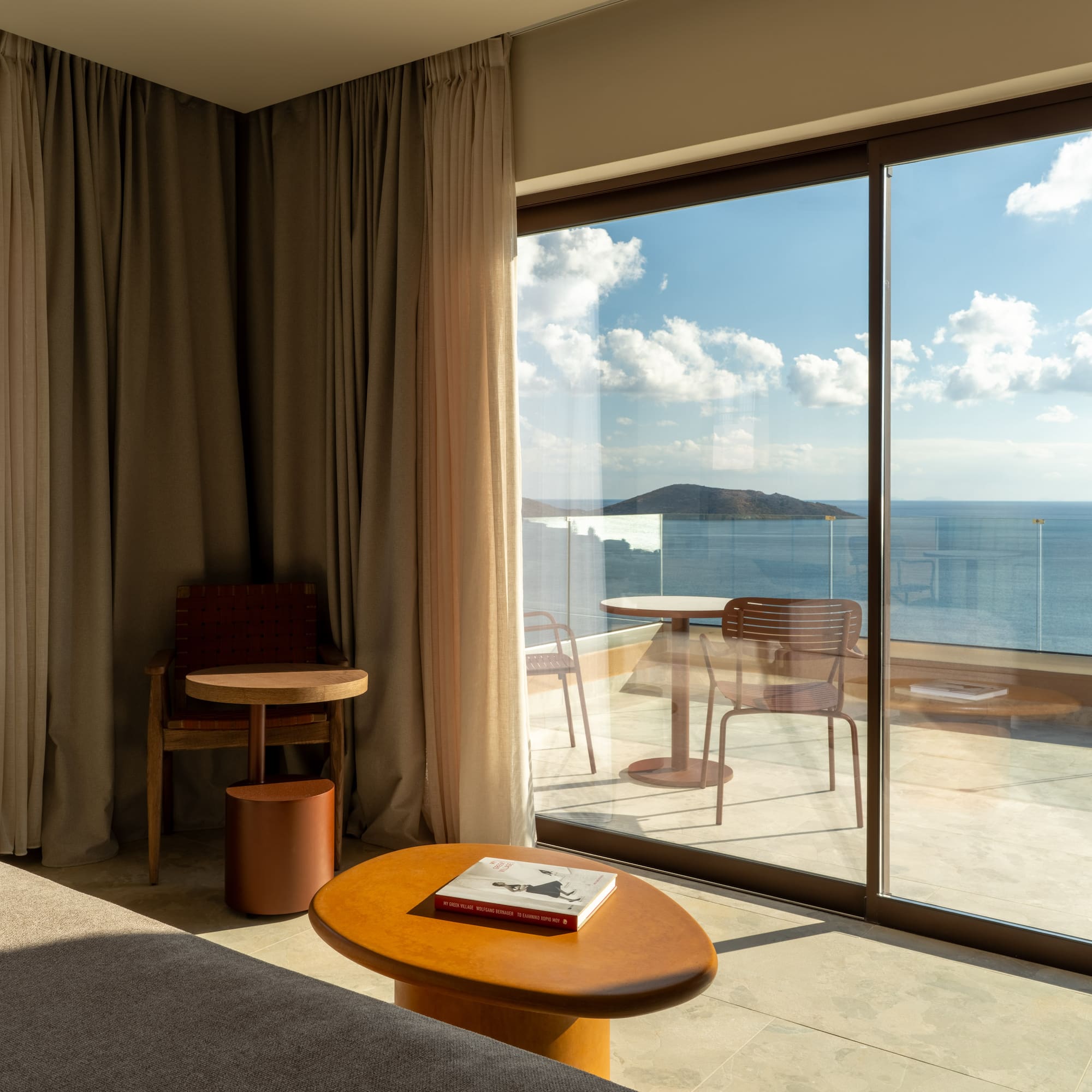 a room with a view of the ocean from the window
