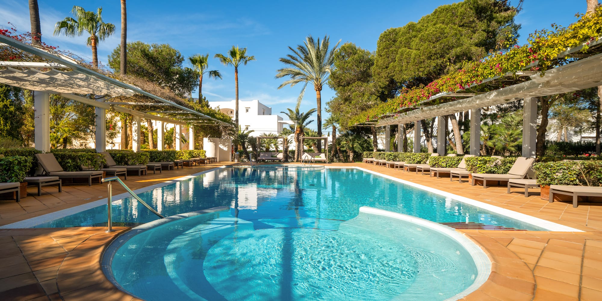 a pool with a deck and trees