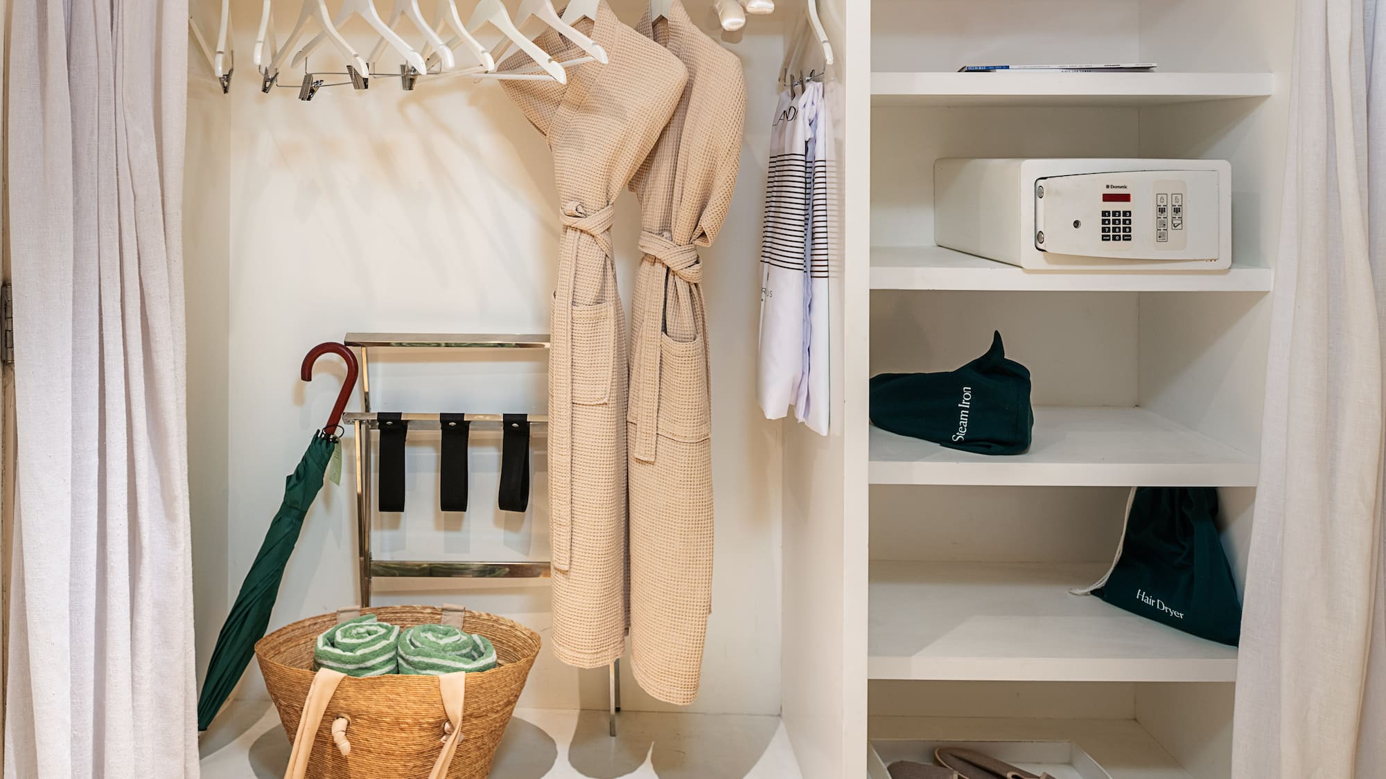 a closet with a towel and a basket
