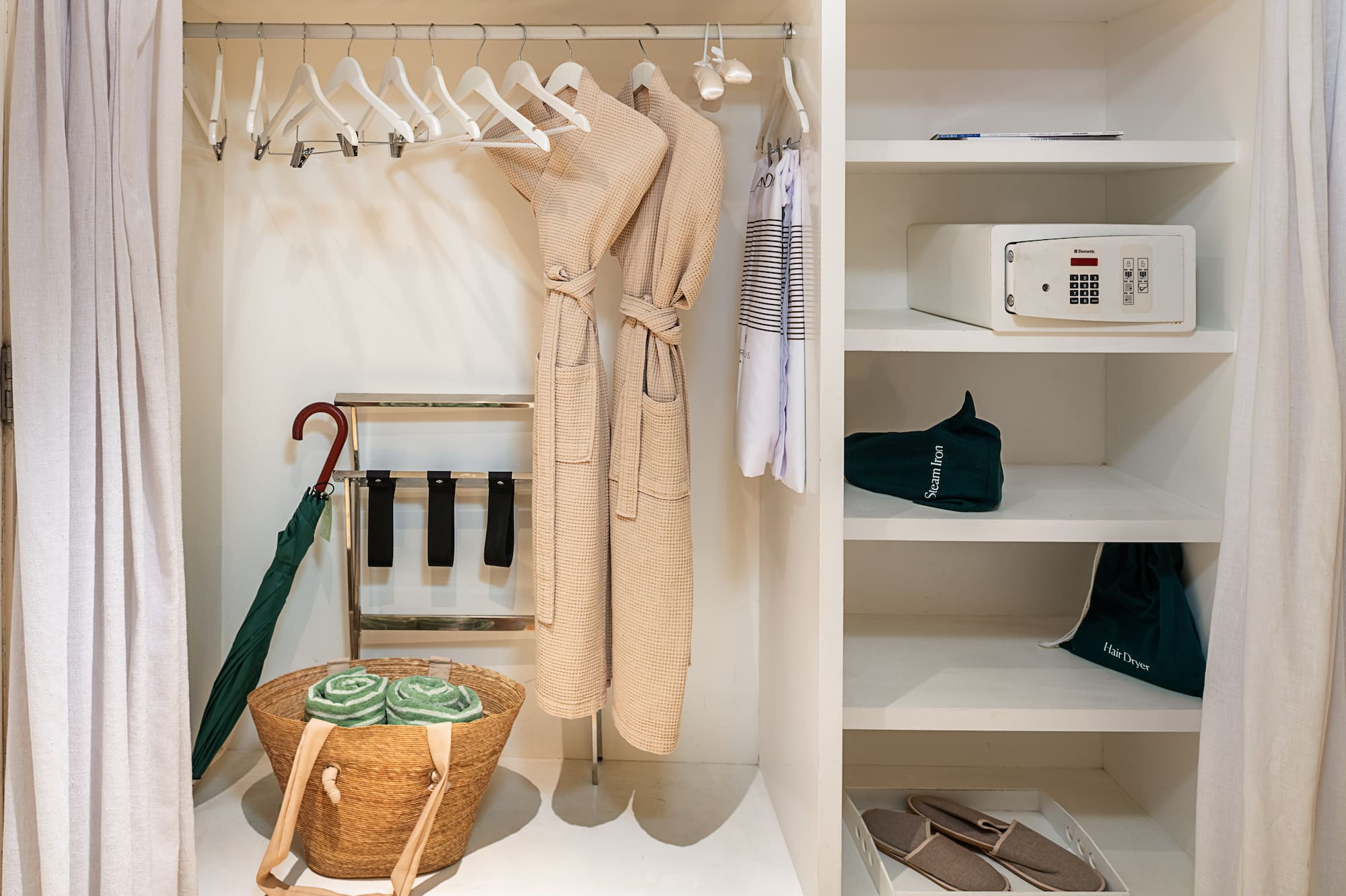 a closet with a towel and a basket