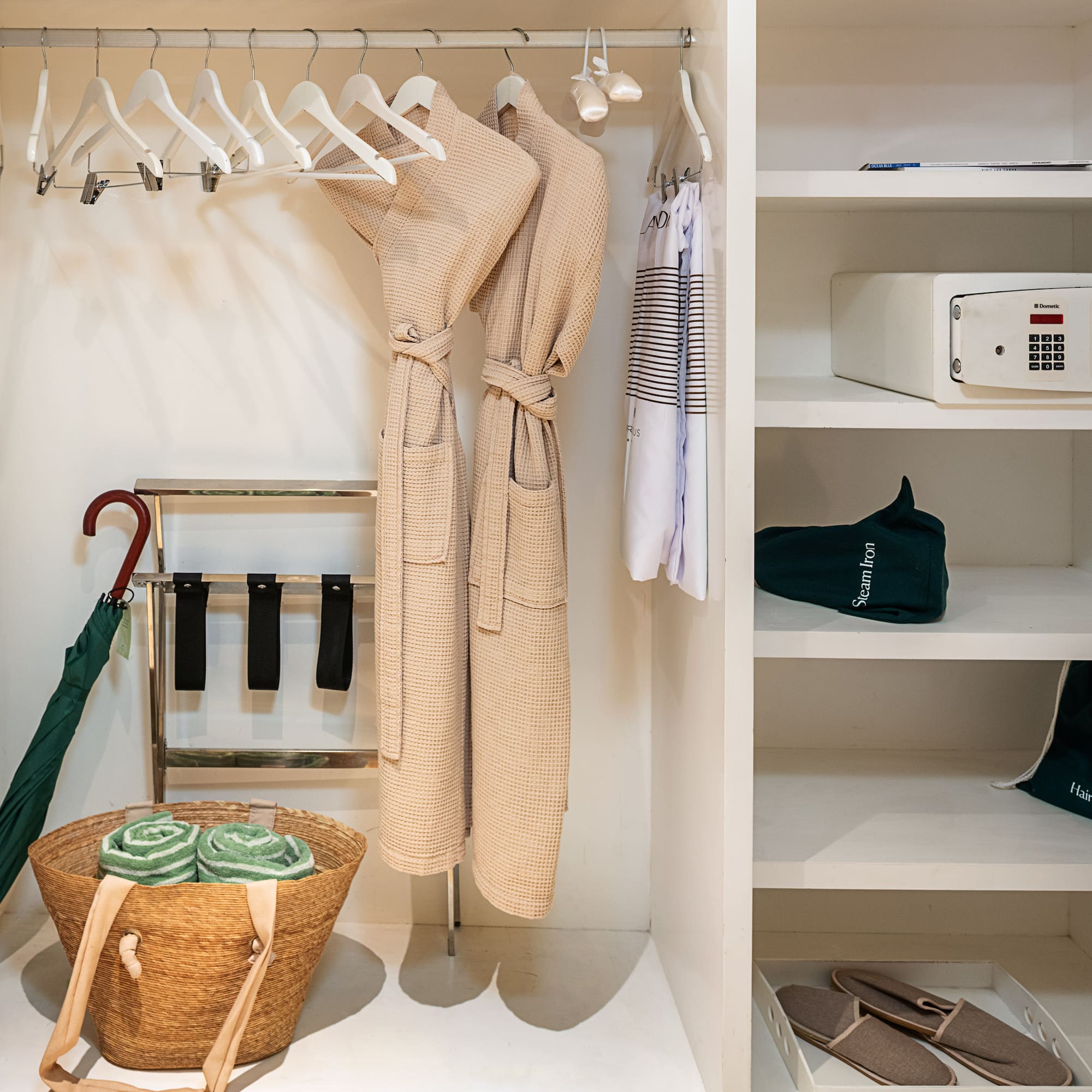 a closet with a towel and a basket