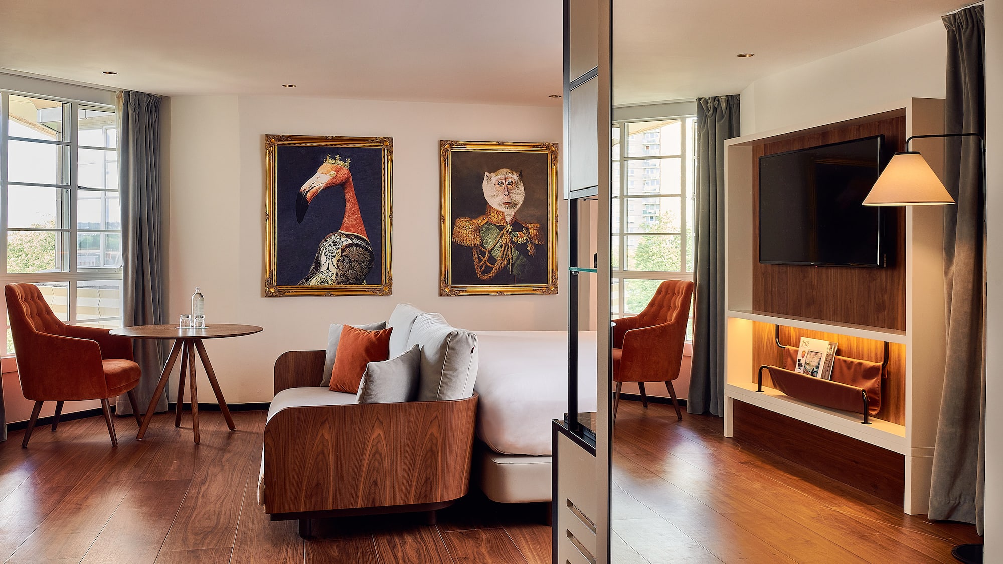 a room with a bed and a television