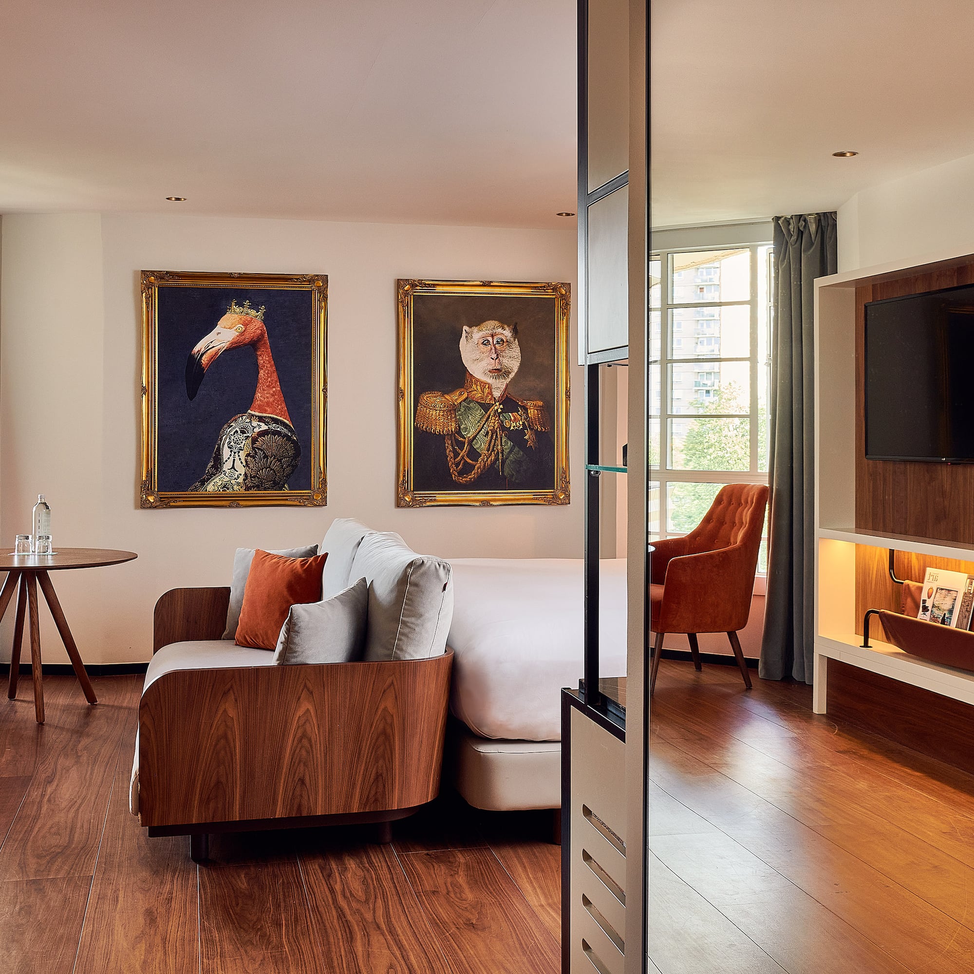 a room with a bed and a television